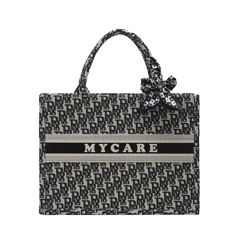 Bolsos bordados de alta calidad para mujeres 2026 nuevas letras de tela transfronterizas retro bolsas de mano de transporte de gran capacidad