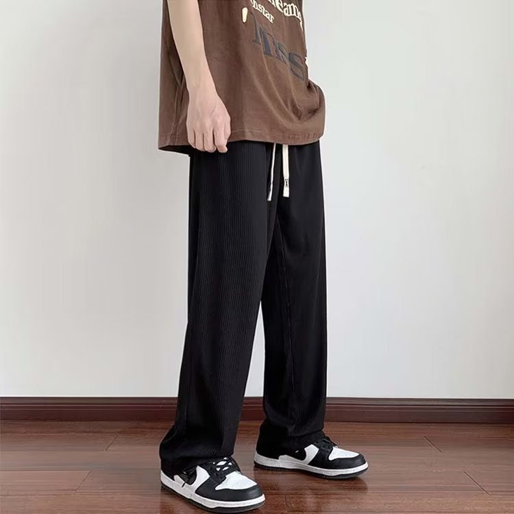 Verano delgado hombre 2026 nueva tendencia confortable pull-out pantalones largos de piernas largas pantalones de chicos rectos sueltos