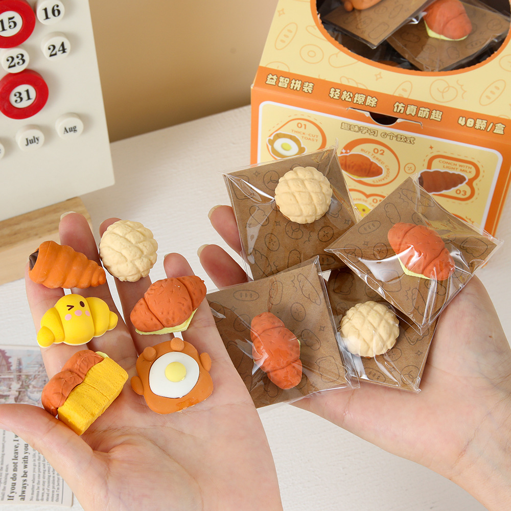 Nuevos productos Yuanqi desayuno simulación de alimentos juegan borracha de goma de papelería de estudiantes limpieza borracha de goma de ensamblaje inteligente