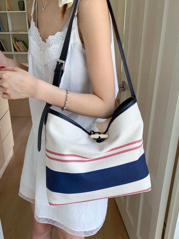 Bolso mujer 2025 nuevo bolso de cubo a rayas simple moda bolso de hombro casual de alta gama bolso de mensajero casual