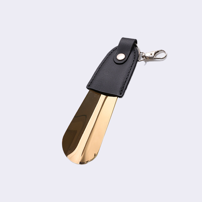 Inventario al por mayor de acero inoxidable llaver de zapato de tirador de cuero funda de zapato portátil de tirador de zapato de coche llave colgante elevador de zapato