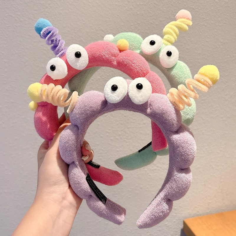 Hermosos ojos grandes torsión varilla esponja banda de cabello para mujeres creativa extraña banda de cabello antideslizante tocado de lavado de cara broca de cabello