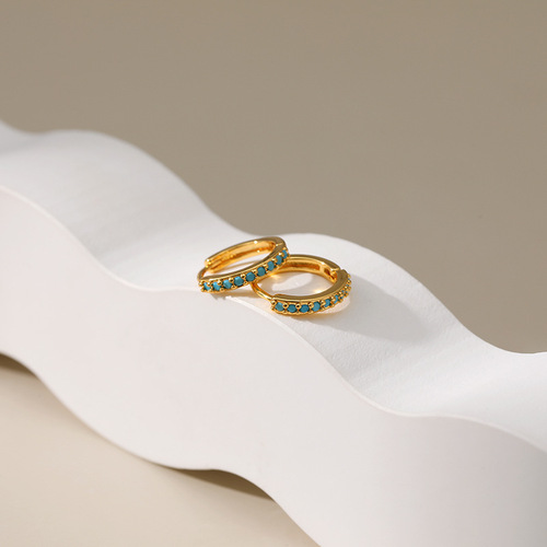 Earrings with a cool and chic style, plated with 18K gold, featuring a circle design with micro-set turquoise accents, embodying a light luxury feel.