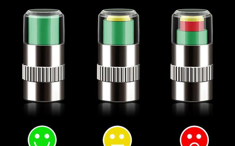 Tire pressure monitoring valve core with three-color warning for tire pressure monitoring