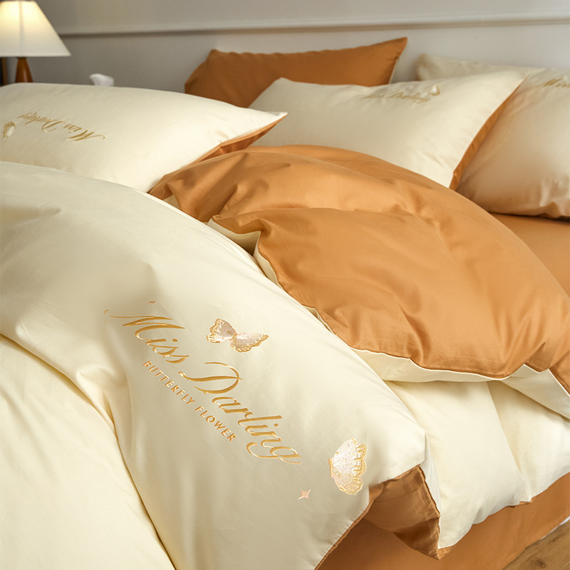 Estilo de lujo ligero 40 piezas de algodón puro traje de cuatro piezas corazón de niña bordado floral funda de edredón ropa de cama de algodón suave de alta calidad