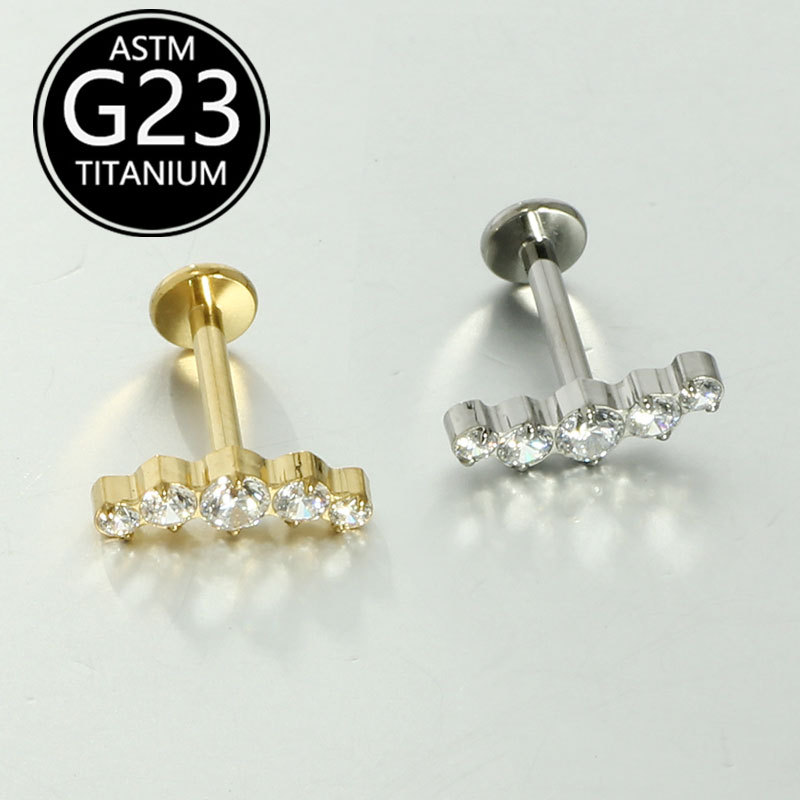 Silver pointed spike labret stud material detail