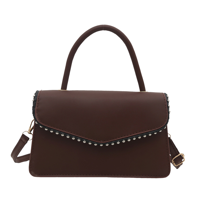 Bolso de hombro de aire extranjero para mujeres 2025 primavera nueva moda coreana portátil de color sólido simple bolso de tendencia