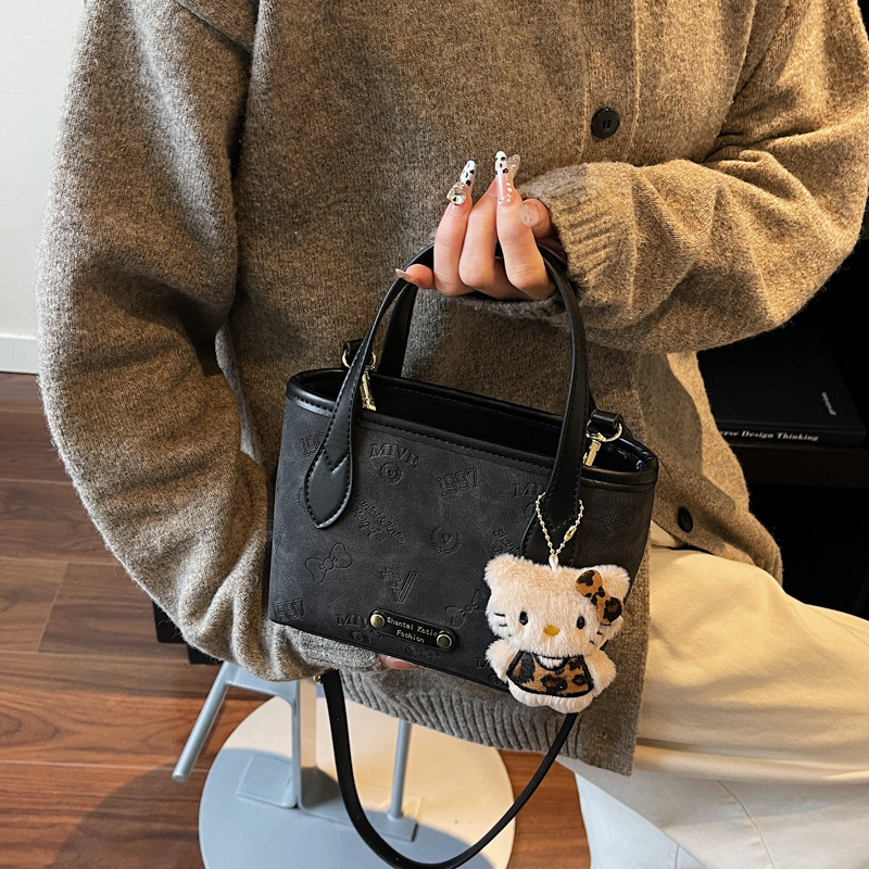 Corea del Sur super caliente retro bolso de mano de estilo extranjero para mujeres 2025 nueva moda simple hombro mochila bolso de cubo de moda