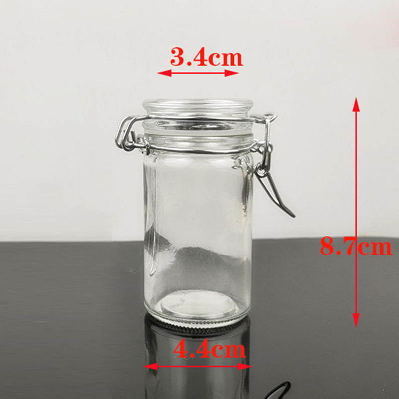 Hebilla tarro de almacenamiento botella de vidrio redondo tarro de caramelo tarro de té de vela botella sellada botella de condimento botella de almacenamiento pequeña