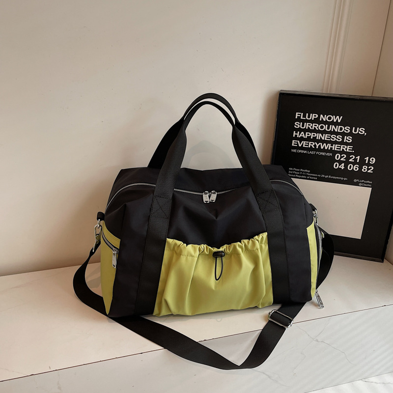 Bolsas deportivas de gran capacidad de ocio, bolsas de viaje de hombro simples de moda para mujeres, bolsas de mano ligeras de tirado.