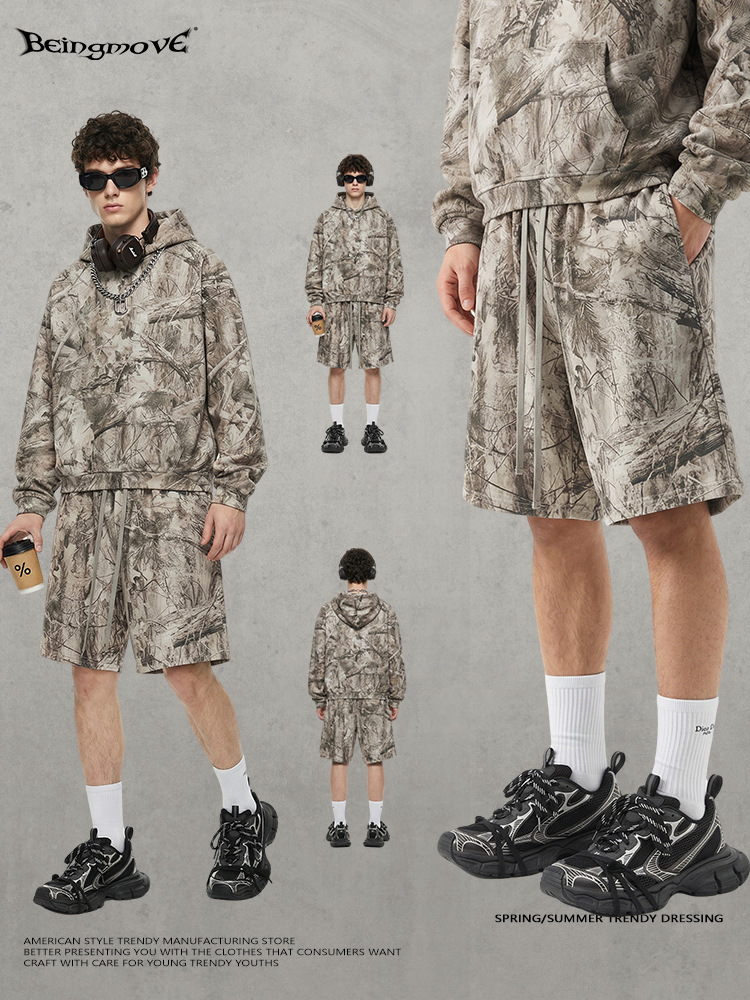Calle secada| 2025 otoño y invierno Europa y América retro camuflaje del desierto con camisa encapuchada suelta pantalones cortos para hombre