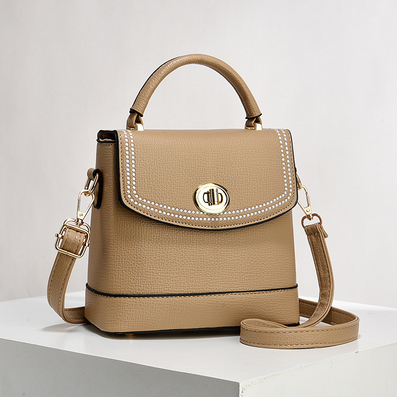 Bolso de mujer nuevo nicho de diseño texturizado bolso de hombro de moda moda bolso de mano práctica mochila bolsas