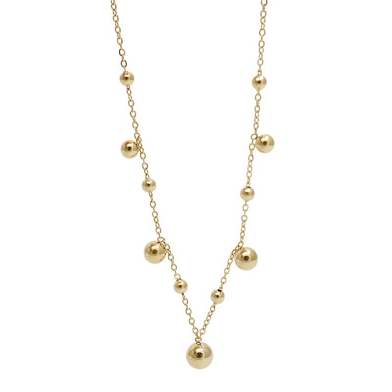 Coreano simple nicho exquisito pequeño oro bola tobillar mujer ins temperamento retro versátil pie accesorios de acero de titanio chapado en oro