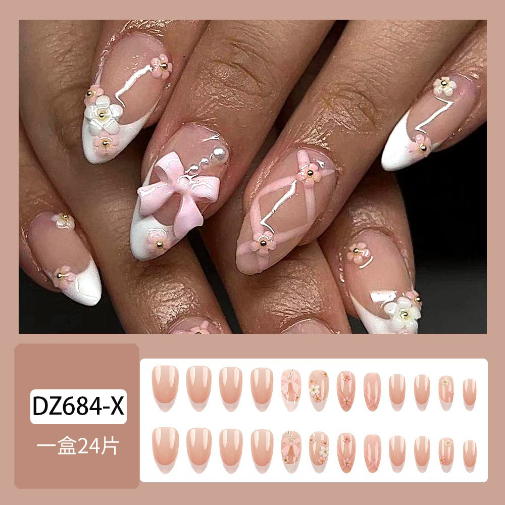 Uñas postizas estilo Hot Girl con borde blanco, puntas de uñas con lazo de alta gama, uñas postizas almendradas más vendidas transfronterizas.