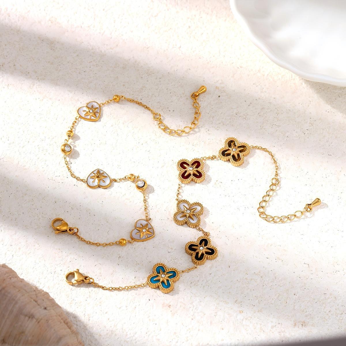 TENA Europa y los Estados Unidos pulsera de acero inoxidable lujo ligero nicho flores de cuatro hojas amor pulsera de acero de titanio para mujeres no desvanecerse