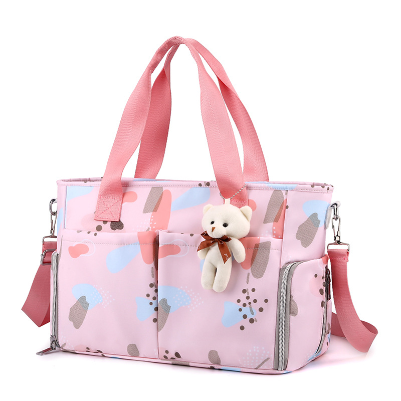 Bolsa de pañales: Iconic Duo Weekender, capacidad extragrande con cambiador y accesorio para cochecito, rosa