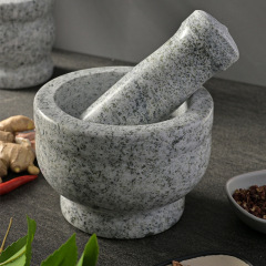 天然石のニンニクをつぶします器の石臼は薬の缶の研磨器の家庭のニンニクの臼をつぶします。