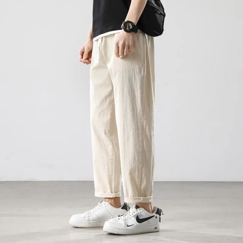 Pantalones de hombre de estilo chino pantalones de lino sueltos casuales primavera y verano pantalones harem de pierna ancha de lino de algodón recto fino linterna