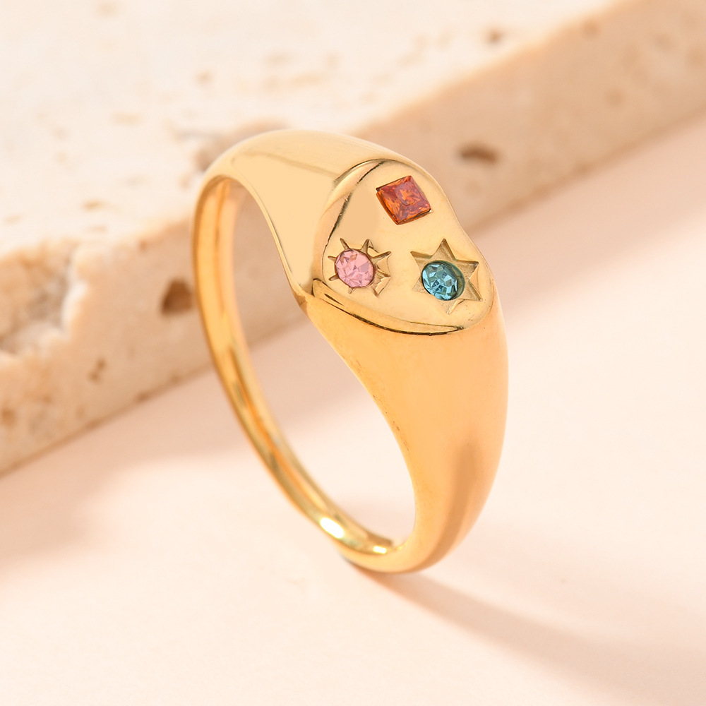 Europa y los Estados Unidos nuevos anillos de acero inoxidable fundidos en forma de corazón hermoso viento micro incrustado de color zircon fábrica de anillos de acero de titanio