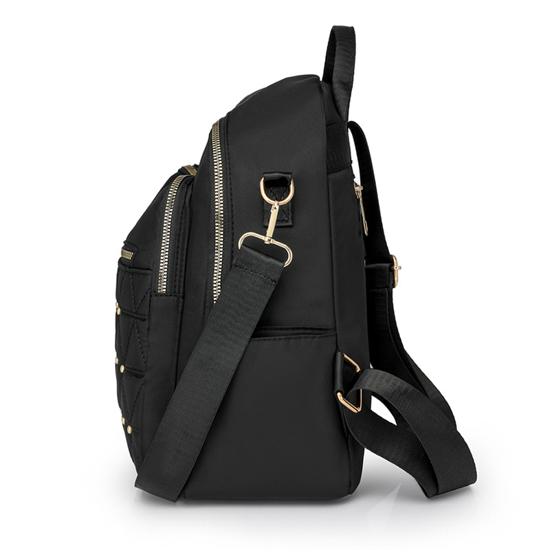 Mochila con remaches bordados de ringge para mujer 2025 nueva bolsa de viaje de moda casual todo-fósforo de gran capacidad para mujer