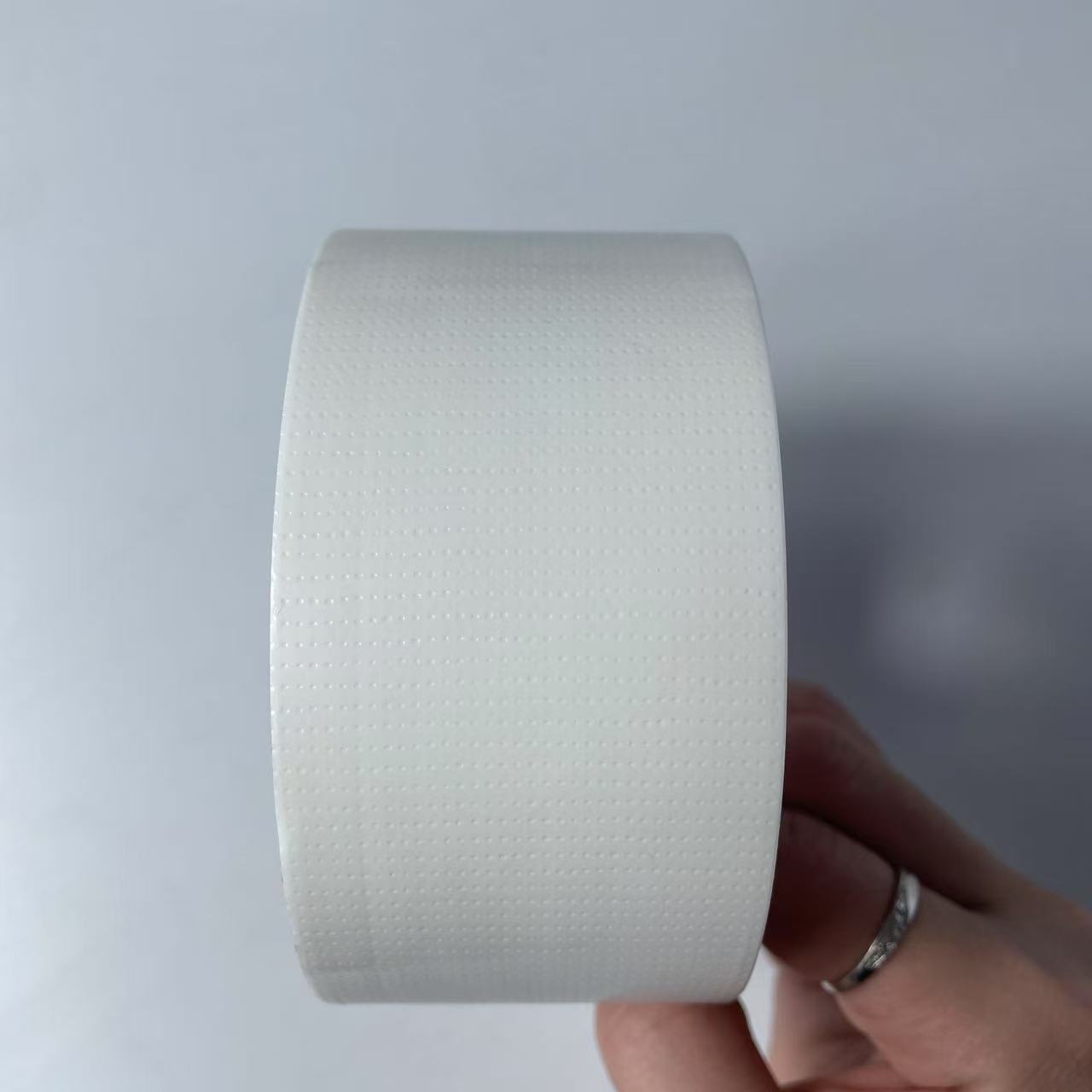 Tape adhesiva de tela de alta viscosidad decoración sin rastro película adhesiva de tela de malla adhesiva de tela unilateral cinta adhesiva de tela