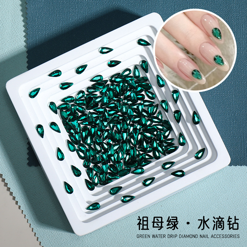 Manicure nuevo esmeralda gota de agua de fondo plano manicure perforación de gota de agua larga perforación de red de color rojo blanqueador decoración de uñas