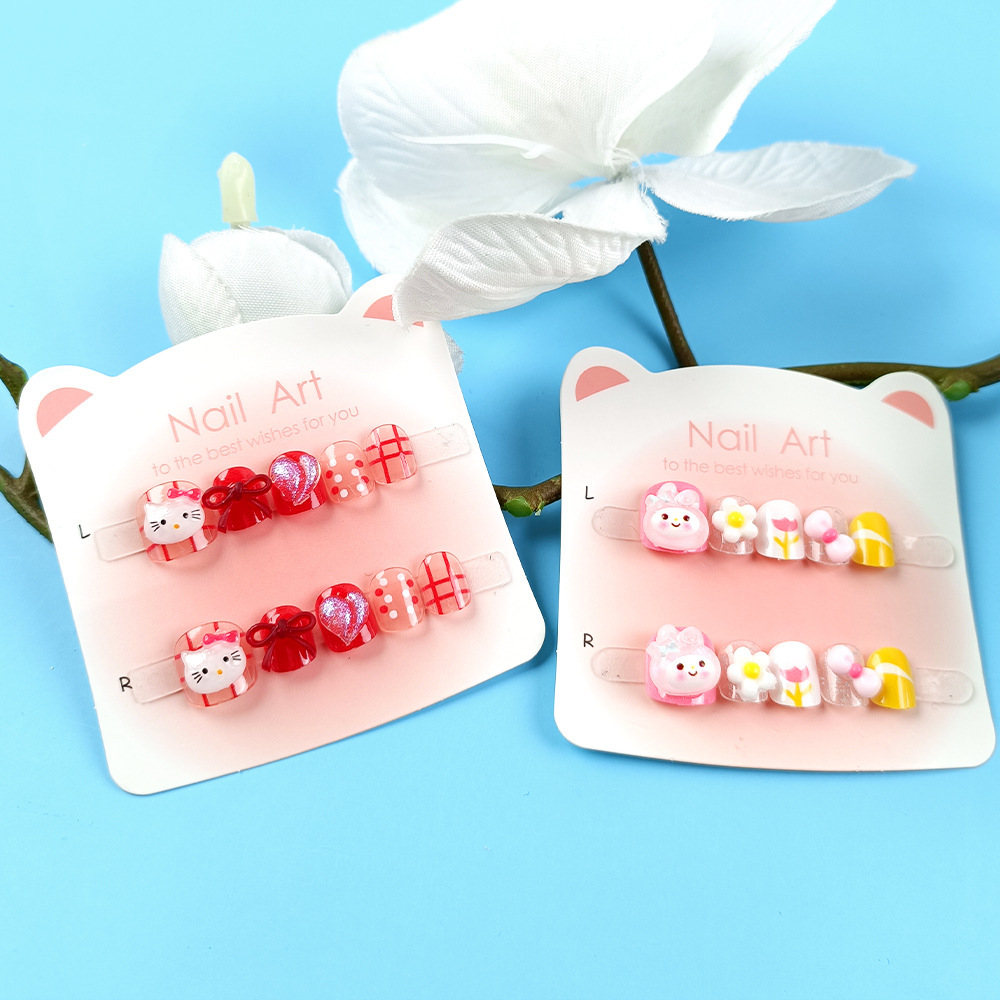 Punto de perforación diez piezas de papel de cartón de manicura gato arco de mariposa niños que usan uñas dibujos animados adorables parches de uñas para niños