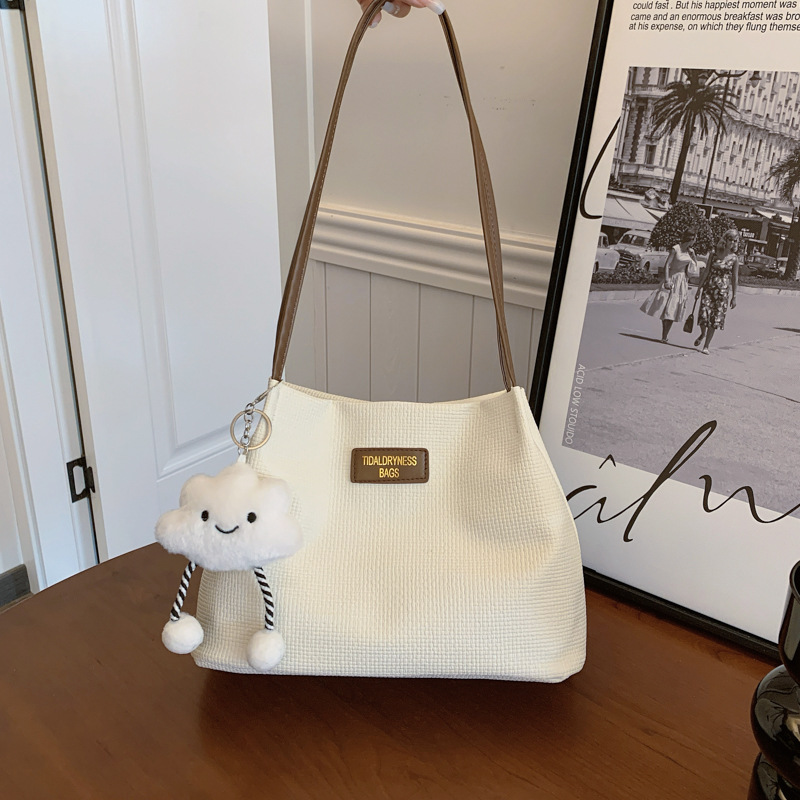 Bolsa de gran capacidad para mujeres 2024 nuevo verano versátil bolso de hombro simple sensación de alto nivel de viaje bolsa de cubo