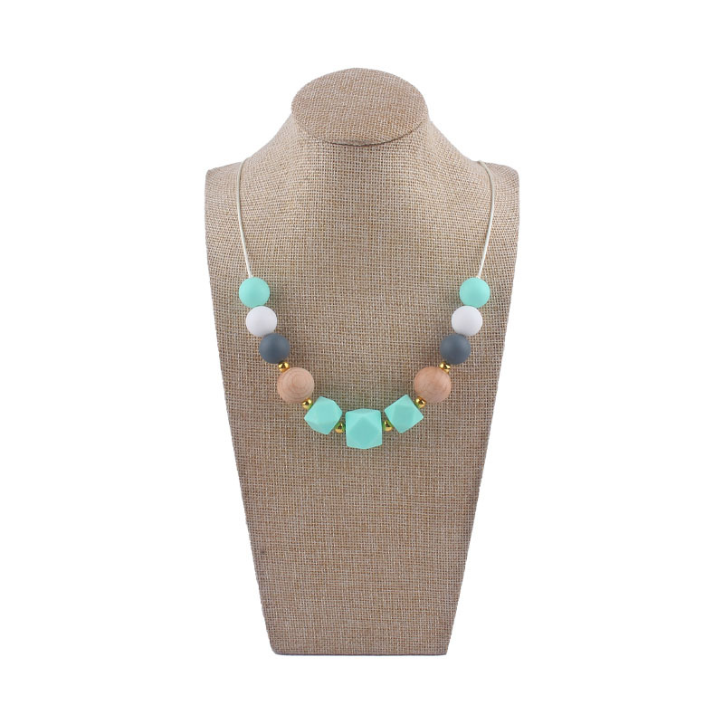 Los nuevos bebés de contraste de color de silicona octogonal mordedor collar de los bebés mordedor palo masticable colgante collar