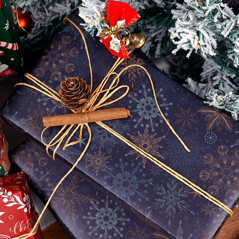 Papel de embalaje de regalos de Navidad transfronterizos Papá Noel campana flocos de nieve Papá Noel flores de embalaje de regalo
