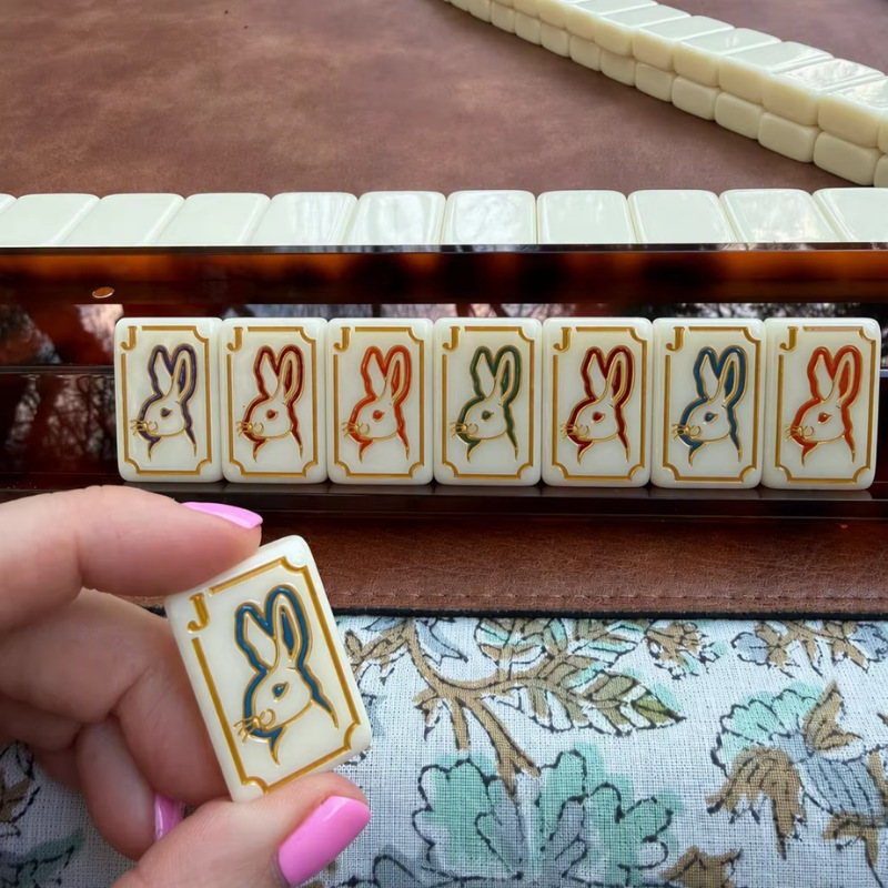 In stock: Luxurious American Mahjong tiles featuring hummingbird designs. The Lucky Rabbit tile serves as a versatile wildcard, perfect for Sunday games