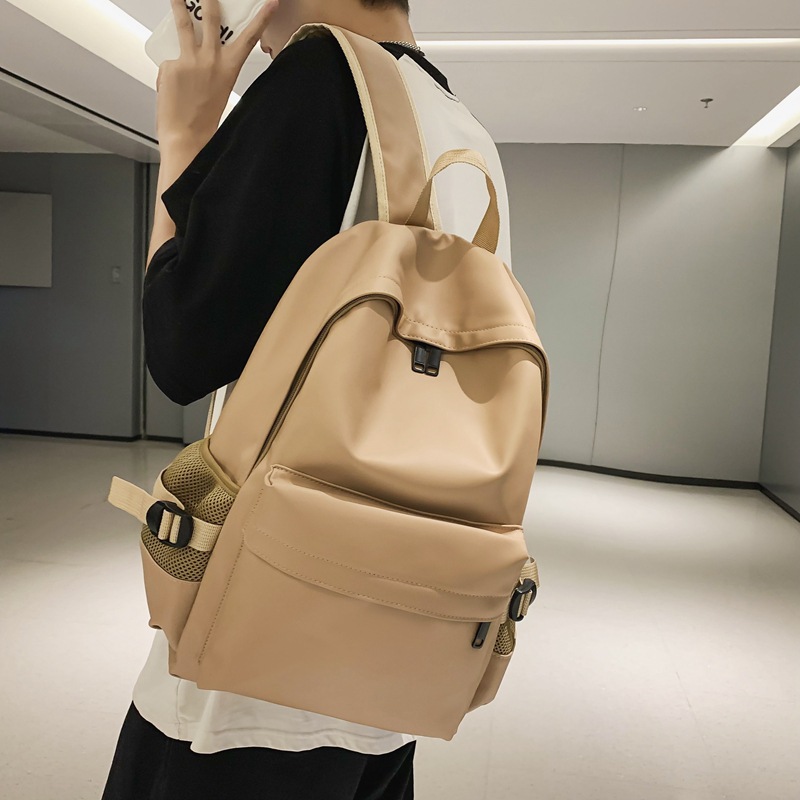 Fábrica al por mayor 2023 nueva mochila de PU de gran capacidad para estudiantes de secundaria de ocio, mochila de viaje al aire libre literaria simple