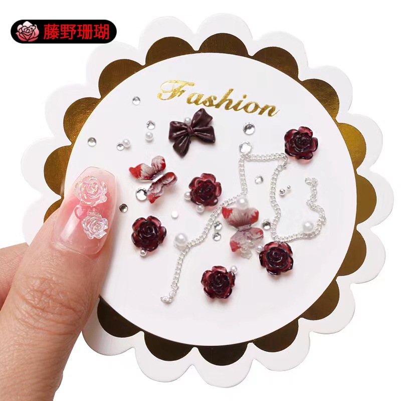 Manicure camellia material paquete de joyería pequeño libro rojo explosión arco mezcla de cadena de joyería de uñas accesorios al por mayor