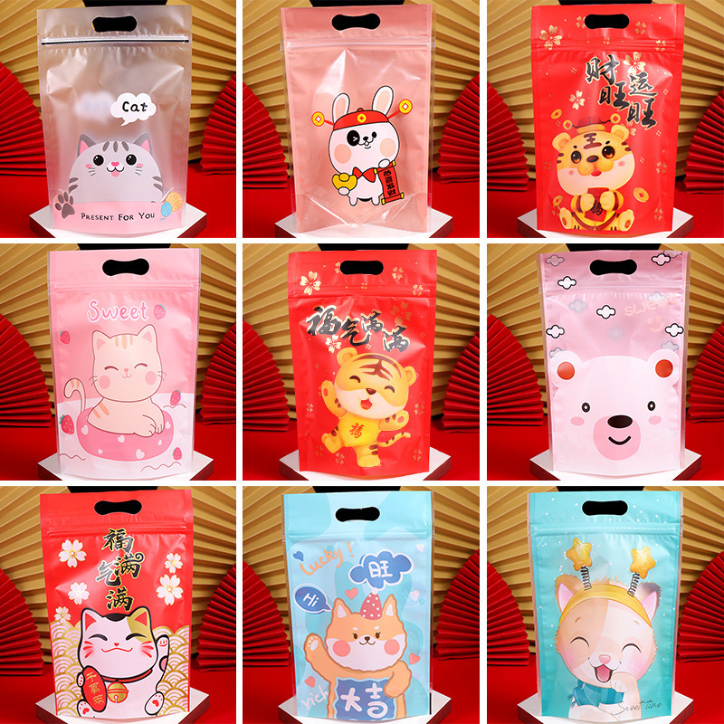 Spot wholesale New Year nougat snowflake crisp packaging bag self-sealing lucky cat biscuit bag milk date handbag 50 Spot wholesale New Year nougat snowflake crisp packaging bag self-sealing lucky cat biscuit bag milk date handbag 50
