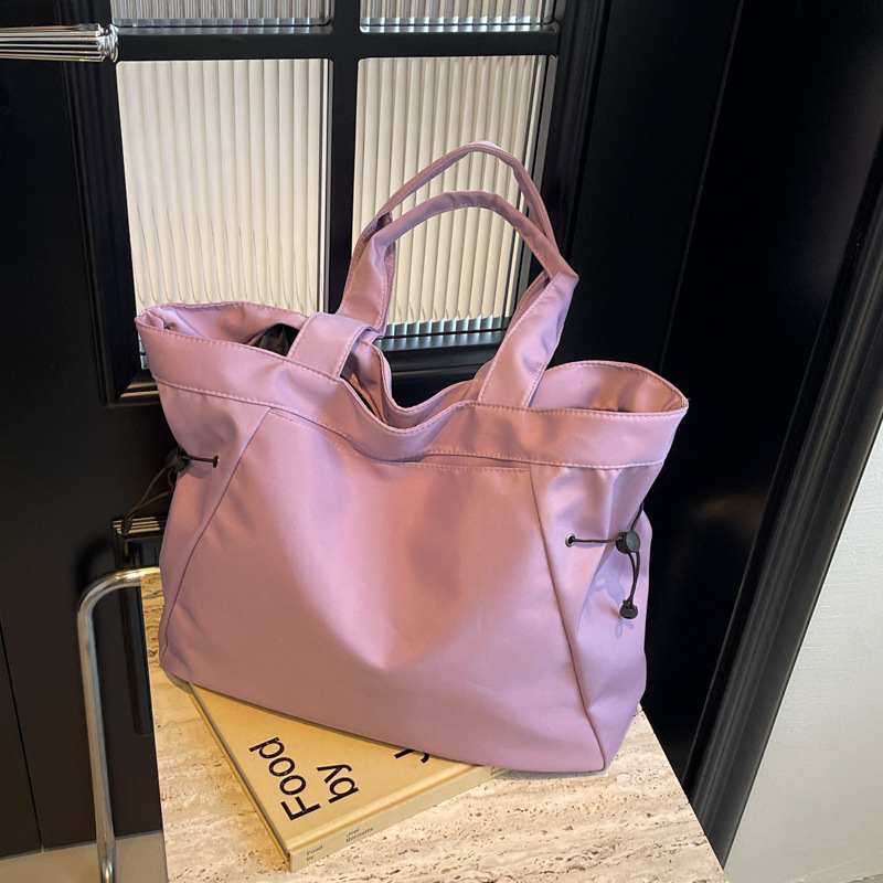 Bolso casual coreano de moda de gran capacidad de color puro 2024 primavera nuevo bolso de axila de un solo hombro ins de todo fósforo