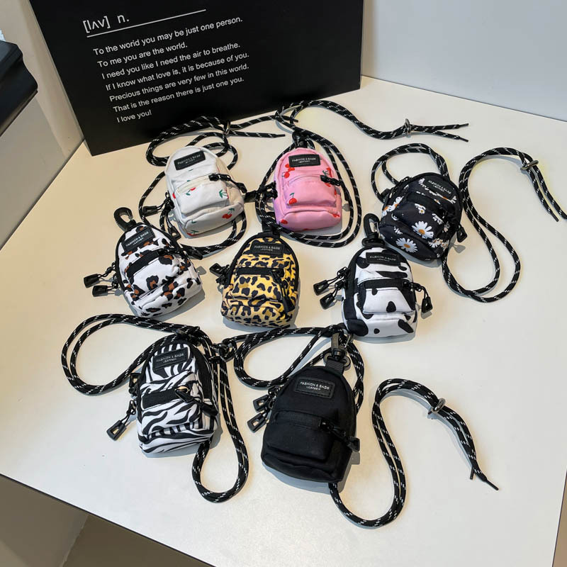 Mini lápiz labial auricular bolsa pequeña 2024 nueva tendencia moda colgante bolso de tela de diseño de nicho bolso de mensajero de un solo hombro