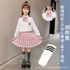 Girly plaid skirt + Haohai long sleeves + bow tie