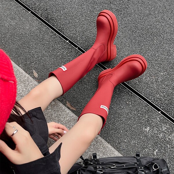 Red autumn high boots made of soft leather platform