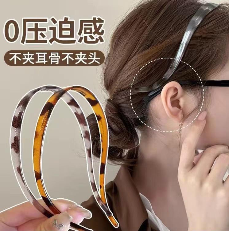 シンプルでファッション的なメガネのカチューシャの女性の高い頭の頂は耳の骨を挟まないで髪のカチューシャを押します。|undefined
