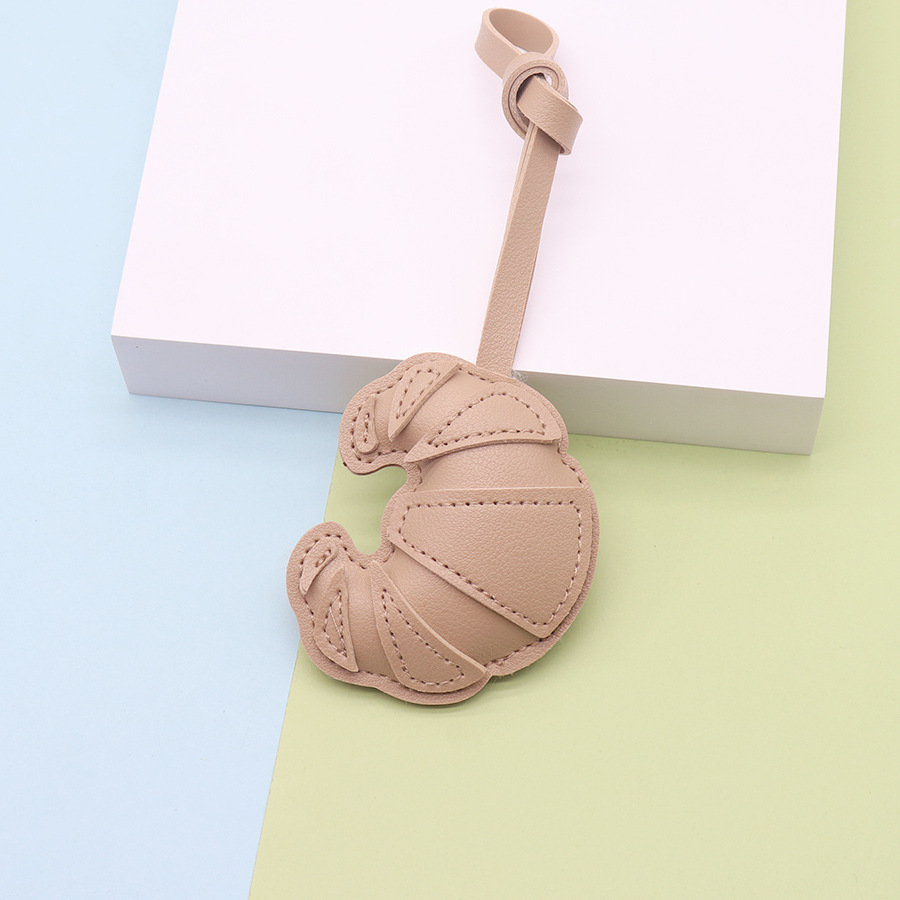 Moda y creatividad cuero de imitación hecho a mano bolso de cuerno hebilla colgante colgante bolso hecho a mano colgante fábrica al por mayor