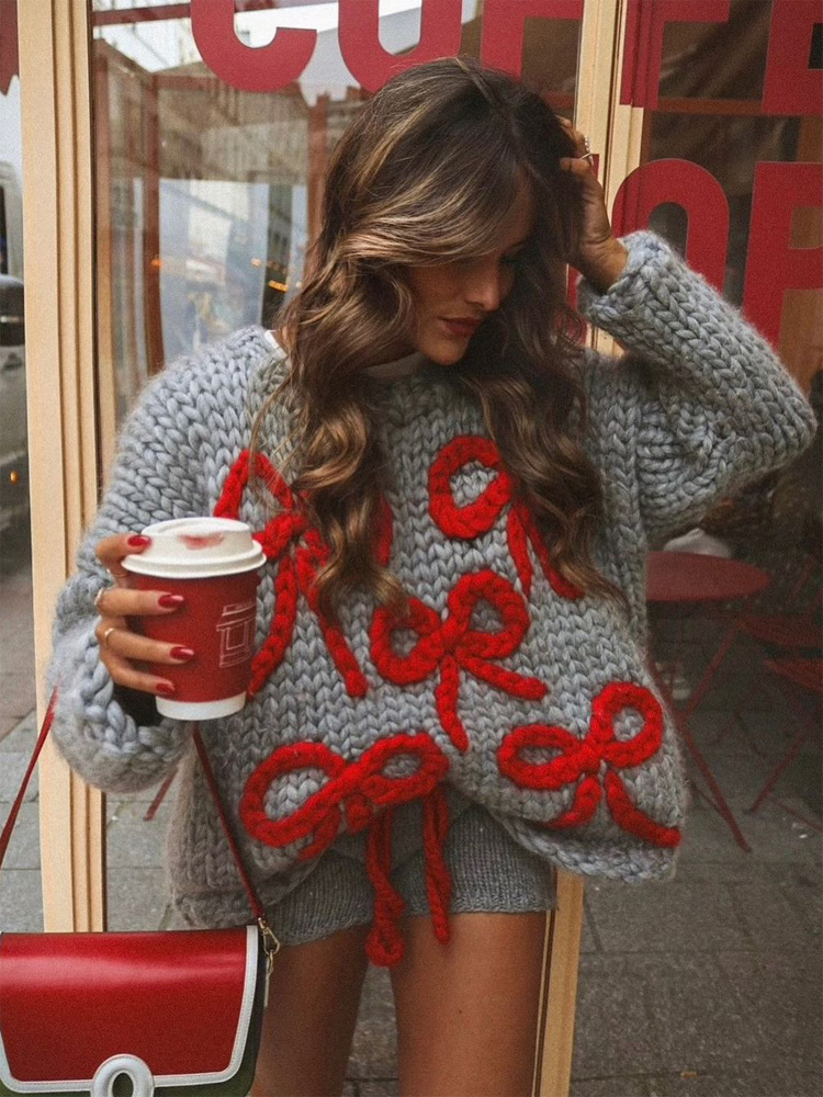 Moda de cuello redondo perezoso arco decoración manga larga suéter suelto 2026 otoño y invierno nuevo estilo transfronterizo europeo y americano