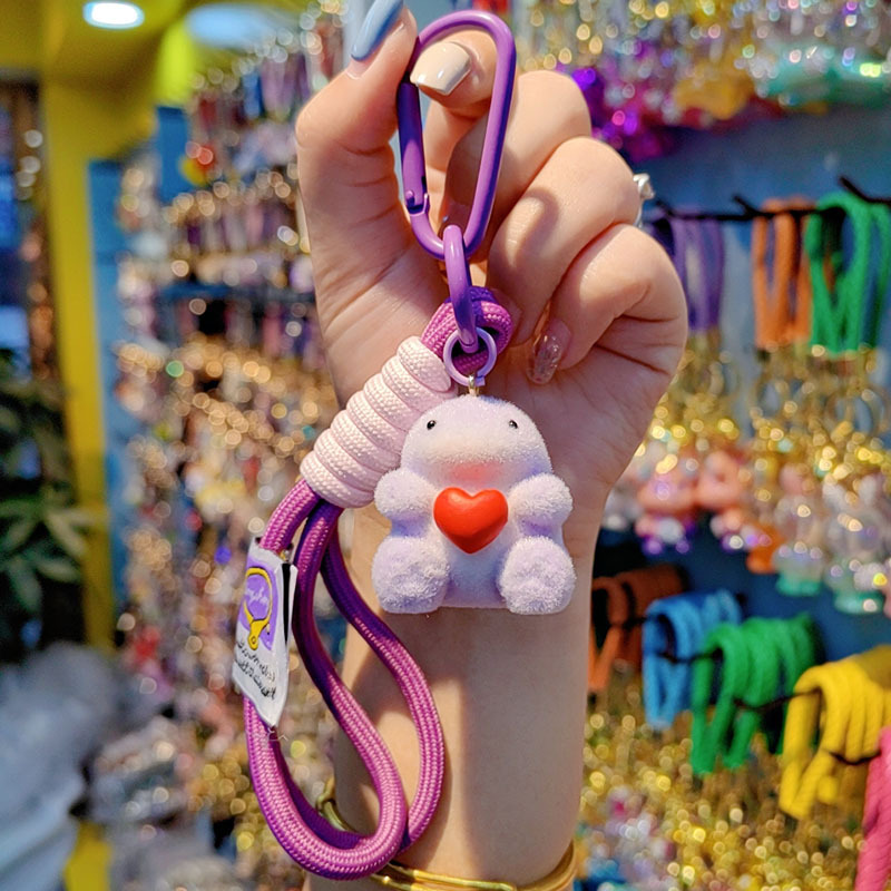 Nuevo caricatura flocado amor Godzilla llavero de moda pareja llavero bolsos de mujer accesorios colgantes de teléfono móvil joyas