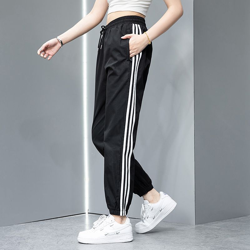 2023 Pantalones deportivos de primavera y otoño pantalones largos casuales para hombres y mujeres Comercio exterior Pareja juvenil suelta slim fit pantalones de chándal atados al tobillo