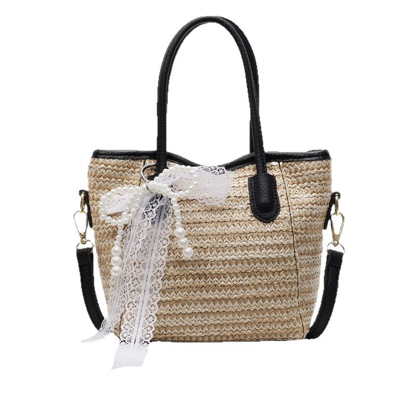 Bolso de cubo portátil de paja de gran capacidad de tendencia para mujer 2025 nuevo bolso de mensajero de hombro de moda de viaje de vacaciones en la playa