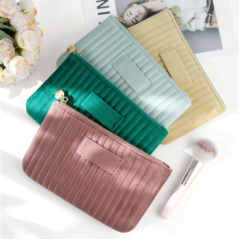 Cross-border velvet cosmetic bag, quilted vertical striped suede clutch for women, high-end style, multi-functional small storage bag.