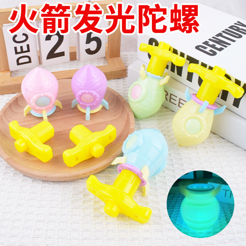 Cohetes creativos giroscópicos de luz jardín de infantes pequeños juguetes recompensas barracas de mercado nocturno juguetes luminosos bebés al por mayor