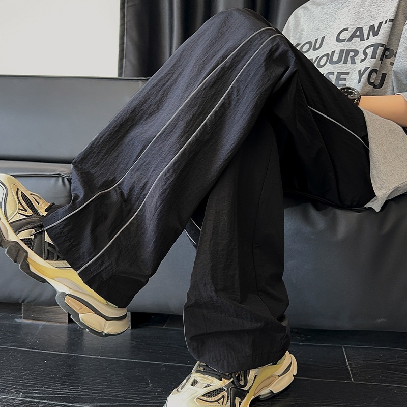 Pantalones blancos de línea clara para hombres de verano delgados pantalones deportivos de pierna ancha de marca de moda pantalones casuales de hombre rectos sueltos