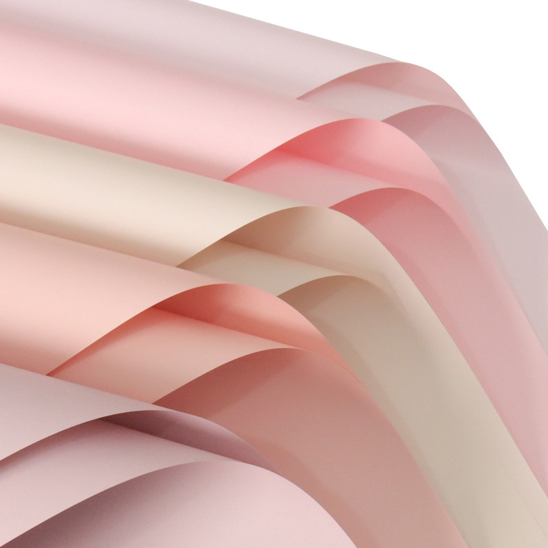 Deca papel de embalaje de flores de color sólido en stock al por mayor papel ouya impermeable material de la tienda de flores papel de embalaje material de bricolaje