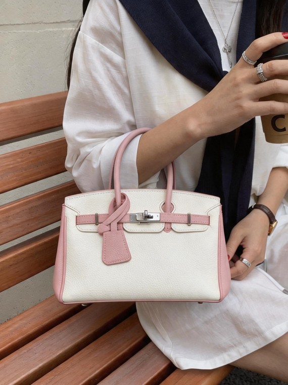Bolso de platino portátil de litchi para mujeres 2026 comercio exterior nuevo estilo de alto nivel de sensación de tamaño de estilo de hombro mochila