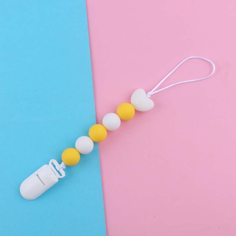 Nuevo bebé suministros de dibujos animados amor silicona DIY creativo macaron color serie mordedura cola molar pezón